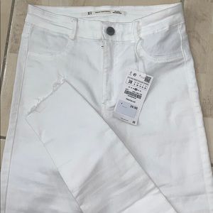 High waisted white ripped in the knees pants